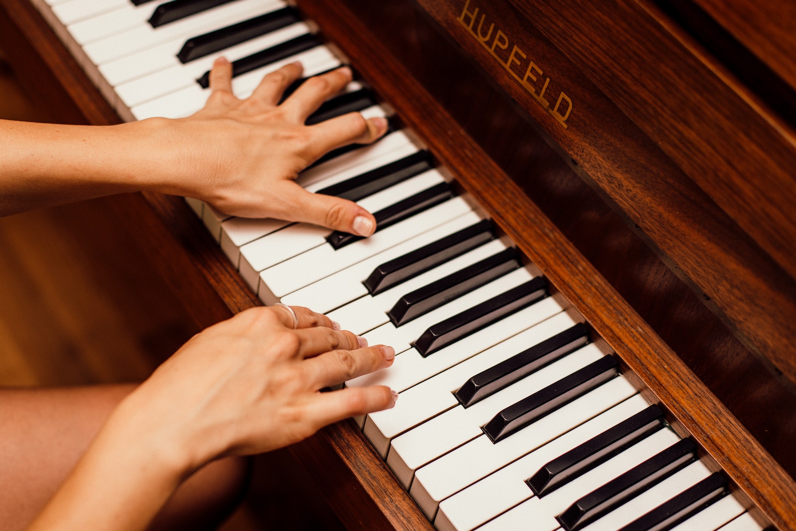 Close-Up Photo Of Person Playing Piano
